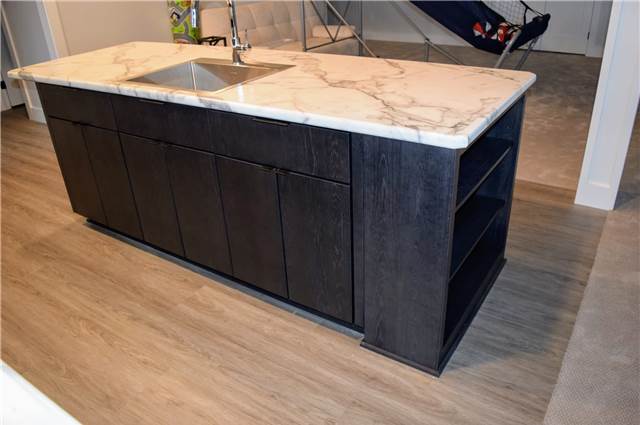 Stained hickory island - Laminate countertop - slab fronts